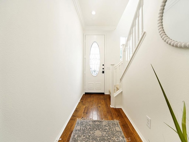 doorway with stairway, baseboards, ornamental molding, and hardwood / wood-style flooring