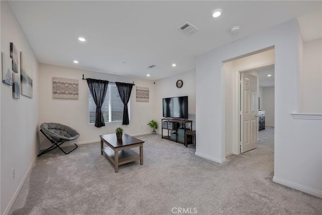 carpeted living room with recessed lighting, visible vents, and baseboards