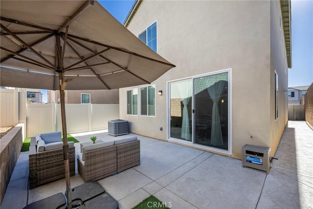 view of patio / terrace featuring an outdoor living space and a fenced backyard