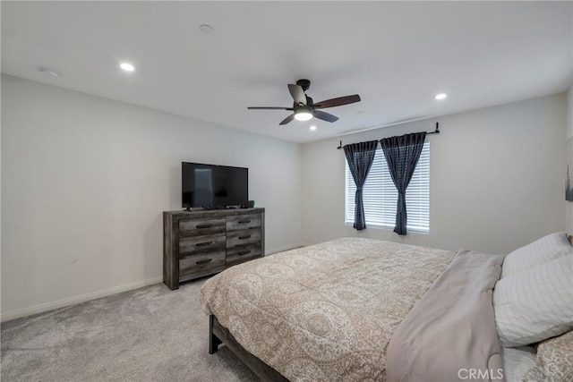 bedroom with a ceiling fan, recessed lighting, baseboards, and light carpet