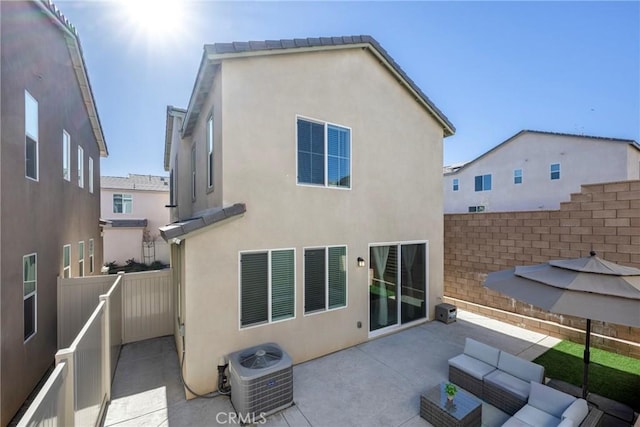 back of house featuring fence, an outdoor living space, stucco siding, central air condition unit, and a patio area