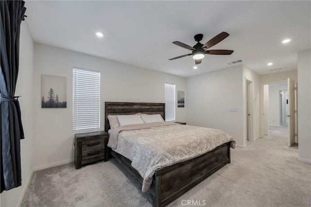 bedroom featuring recessed lighting, visible vents, baseboards, and light colored carpet