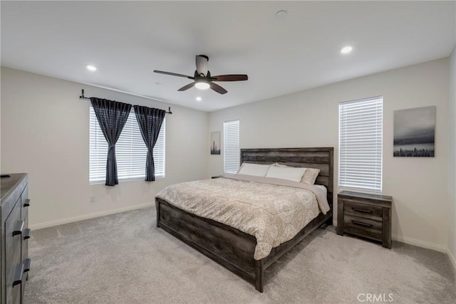 bedroom with recessed lighting, baseboards, and light carpet