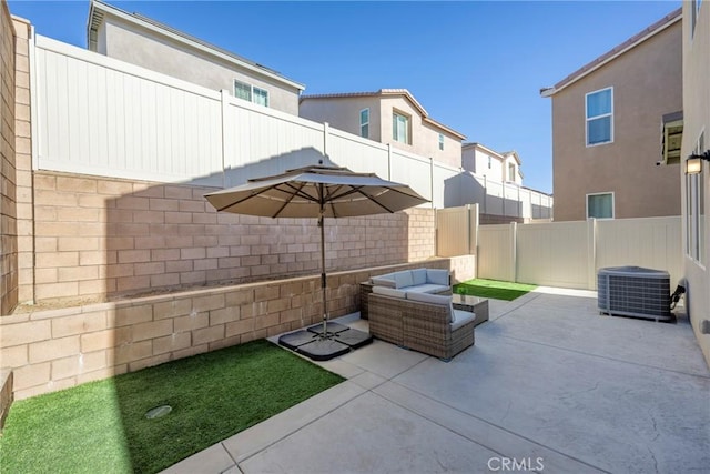 view of patio / terrace with an outdoor living space, central air condition unit, and a fenced backyard