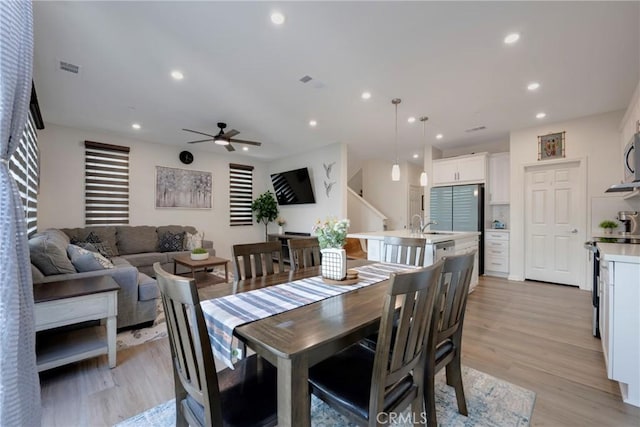 dining room featuring recessed lighting, visible vents, light wood-style flooring, and ceiling fan