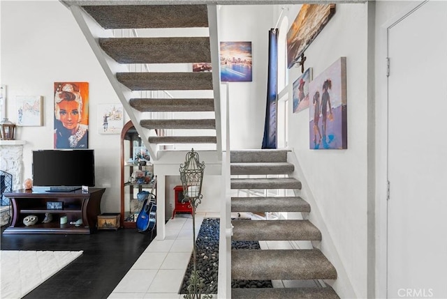 stairway featuring tile patterned floors