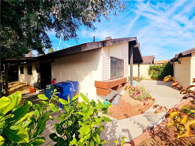 view of property exterior with a patio and stucco siding