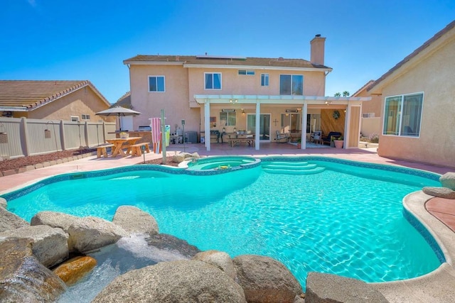 view of pool with outdoor dining space, a patio area, a fenced backyard, and an outdoor hangout area