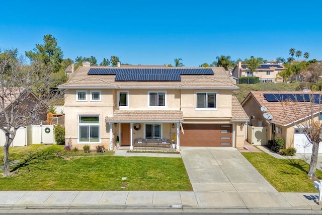 view of front of home featuring a tiled roof, fence, a front lawn, and a gate