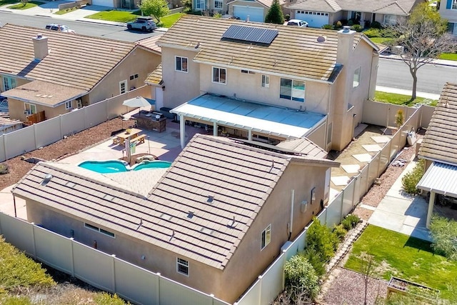 birds eye view of property with a residential view