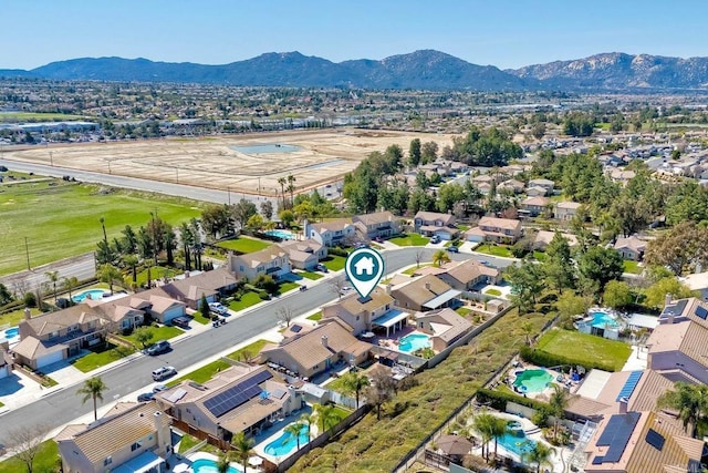 drone / aerial view with a residential view and a mountain view