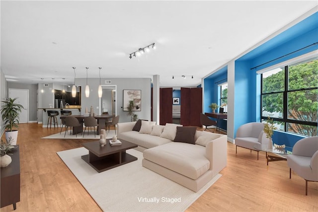 395 E 4th Unit 25, Long Beach, CA 90802 - living area featuring track lighting and light wood-type flooring