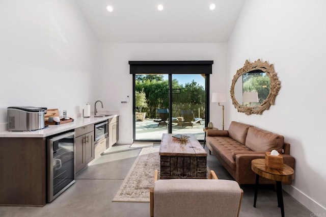 35715 Calle Nopal, Temecula, CA 92592 - living room featuring wine cooler, concrete floors, bar with sink, and recessed lighting