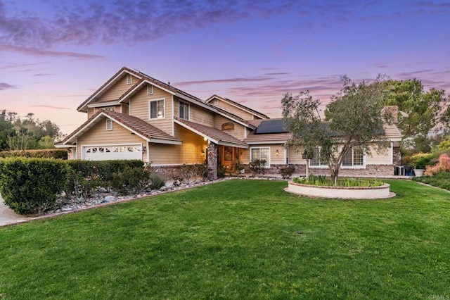 35715 Calle Nopal, Temecula, CA 92592 - view of front of house with solar panels, a lawn, a chimney, and an attached garage