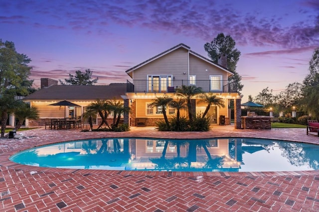 35715 Calle Nopal, Temecula, CA 92592 - pool at dusk featuring a patio area, an outdoor pool, and outdoor dining area