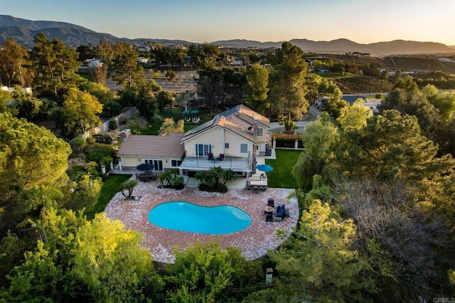 35715 Calle Nopal, Temecula, CA 92592 - aerial view at dusk of view of pool and a mountain view