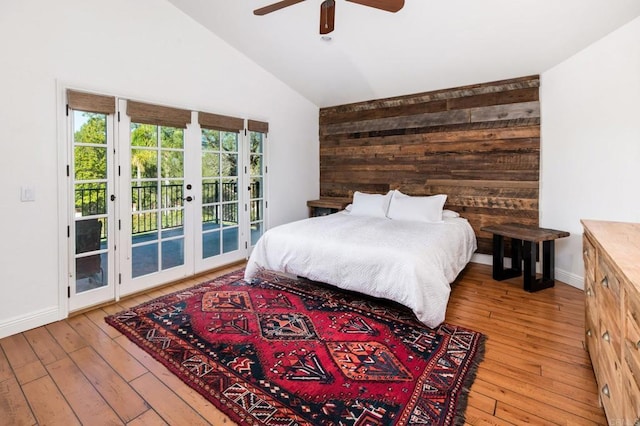 35715 Calle Nopal, Temecula, CA 92592 - bedroom featuring french doors, access to exterior, hardwood / wood-style floors, wooden walls, and ceiling fan