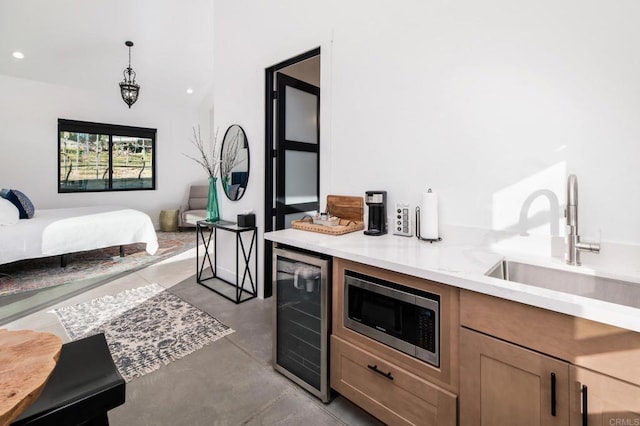 35715 Calle Nopal, Temecula, CA 92592 - bar featuring wine cooler, stainless steel microwave, finished concrete flooring, recessed lighting, and pendant lighting
