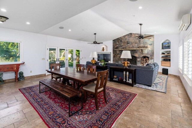 35715 Calle Nopal, Temecula, CA 92592 - dining space featuring ceiling fan, stone tile flooring, a wall mounted AC, vaulted ceiling, and french doors