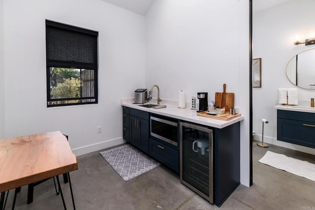 35715 Calle Nopal, Temecula, CA 92592 - indoor wet bar featuring stainless steel microwave, finished concrete floors, and beverage cooler