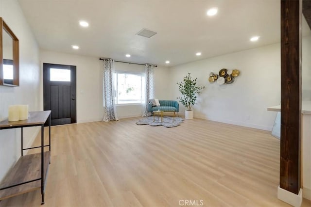 unfurnished room featuring recessed lighting, visible vents, baseboards, and light wood-style flooring