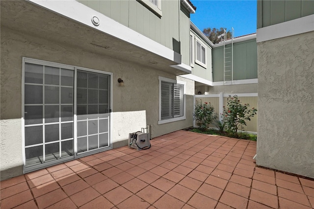 view of patio / terrace featuring fence