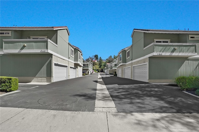 view of street featuring community garages and a residential view