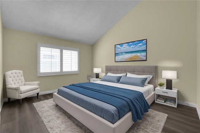 bedroom with baseboards, dark wood-type flooring, and lofted ceiling