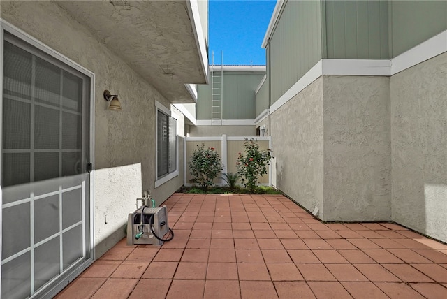 view of patio / terrace featuring fence