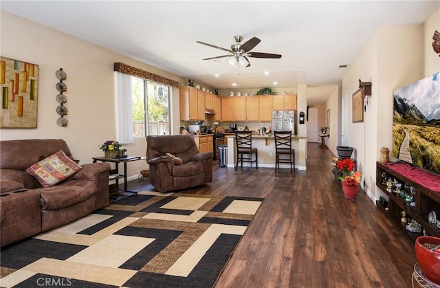 living area with ceiling fan, baseboards, dark wood-style floors, and recessed lighting