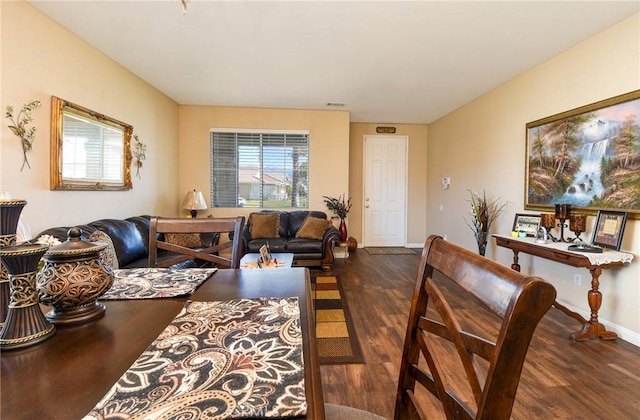 dining area with visible vents, wood finished floors, and baseboards