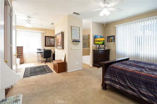 carpeted bedroom with a ceiling fan, baseboards, and visible vents