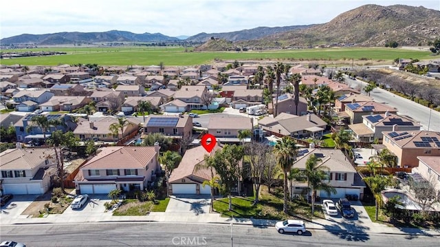 drone / aerial view with a residential view and a mountain view