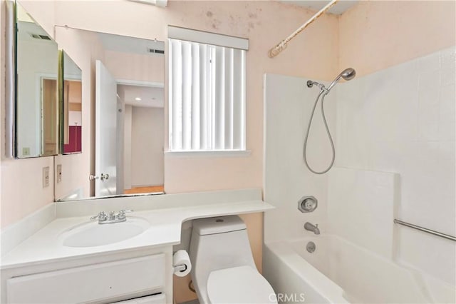 bathroom with vanity, toilet, tub / shower combination, and visible vents