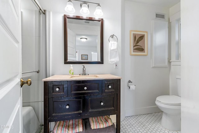 bathroom with vanity, baseboards, visible vents, tile patterned flooring, and toilet