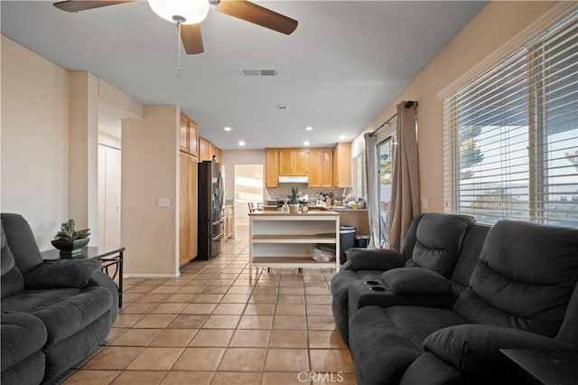 living room with recessed lighting, visible vents, light tile patterned flooring, and a ceiling fan