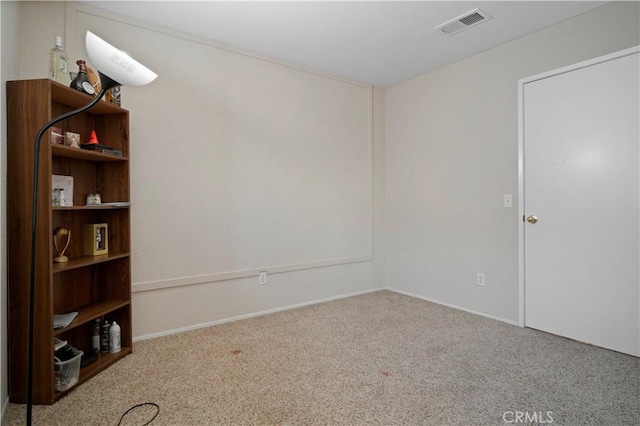 carpeted empty room with visible vents