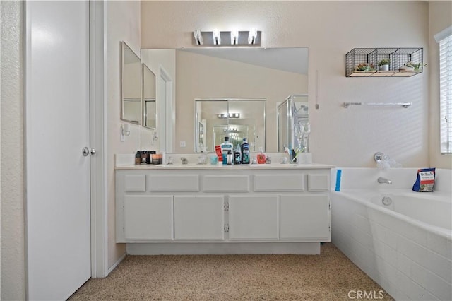 full bathroom with double vanity, carpet flooring, a stall shower, a bath, and a sink