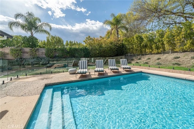 view of pool featuring a fenced in pool, a patio area, and fence