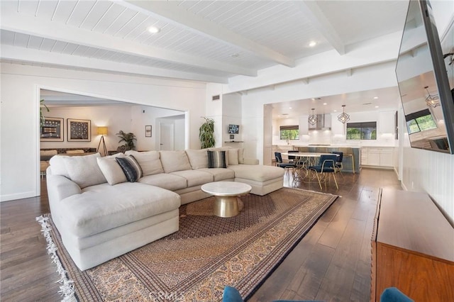 living room with beamed ceiling, recessed lighting, and wood-type flooring