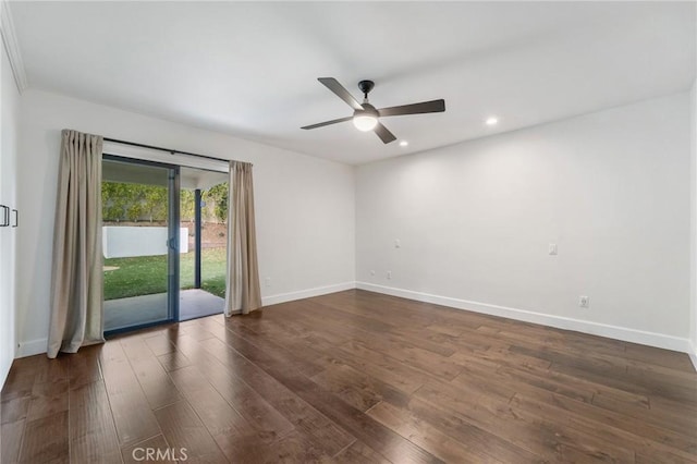 spare room featuring dark wood finished floors, recessed lighting, a ceiling fan, and baseboards