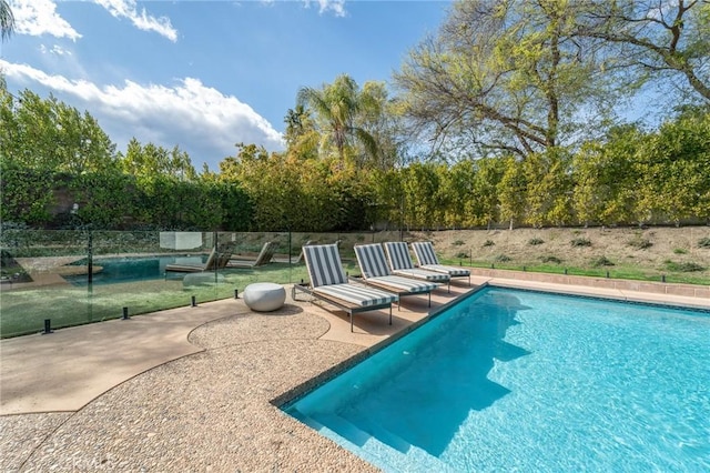 outdoor pool featuring a patio