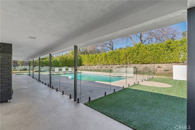 view of swimming pool featuring a patio area, a fenced in pool, and a fenced backyard