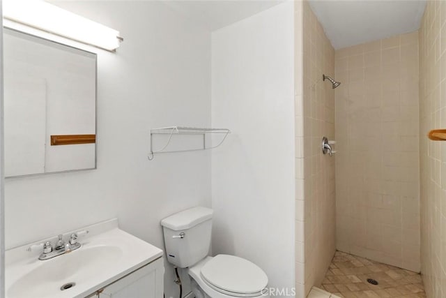 full bath with a shower stall, toilet, and vanity