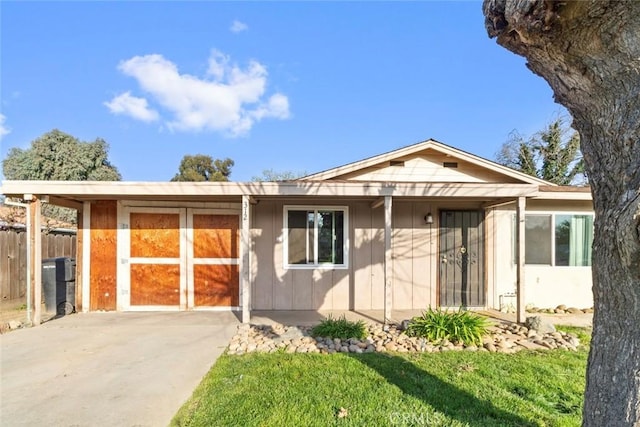 single story home with driveway and fence