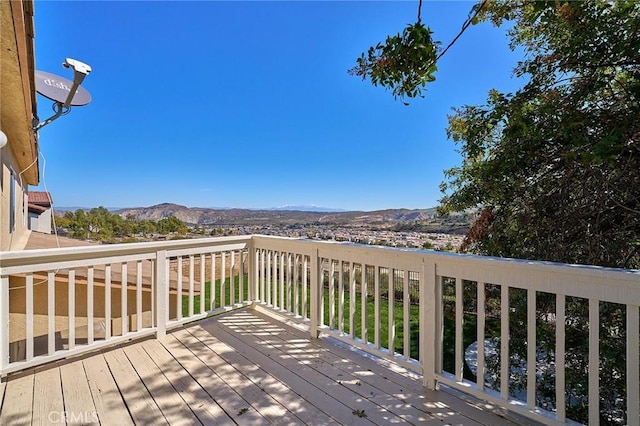 wooden terrace featuring a mountain view