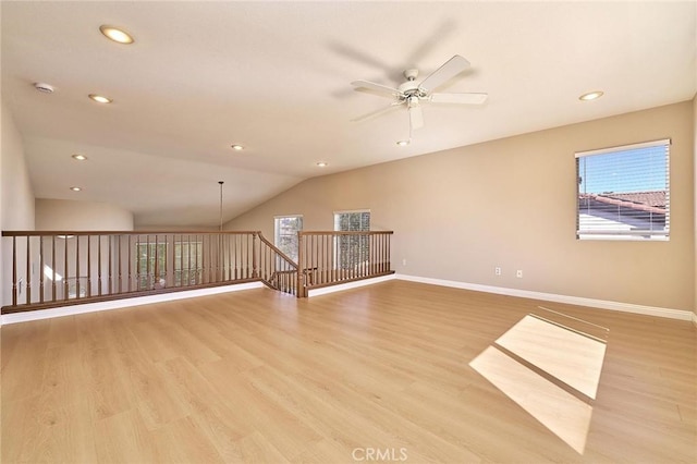 unfurnished room featuring light wood-style flooring, baseboards, and ceiling fan