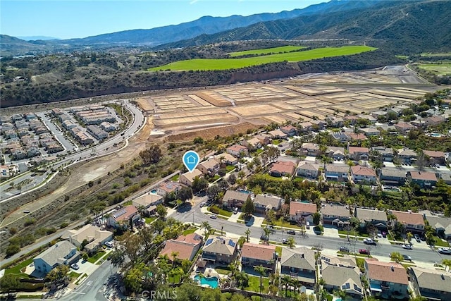 drone / aerial view with a residential view and a mountain view