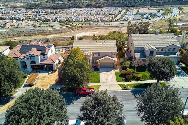 birds eye view of property with a residential view