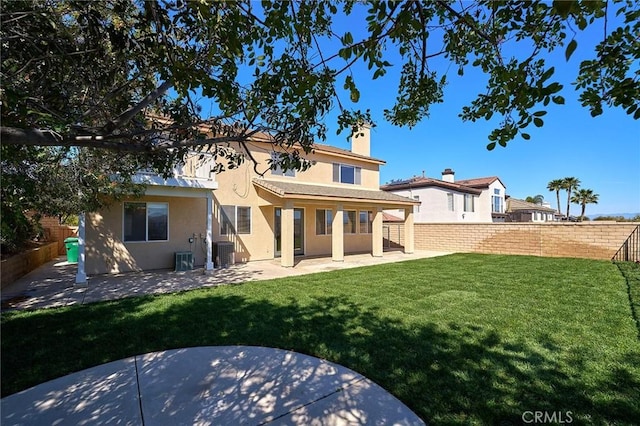 back of property with cooling unit, stucco siding, a patio, and a fenced backyard